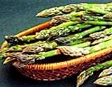 photo of a clay serving dish full of asparagus